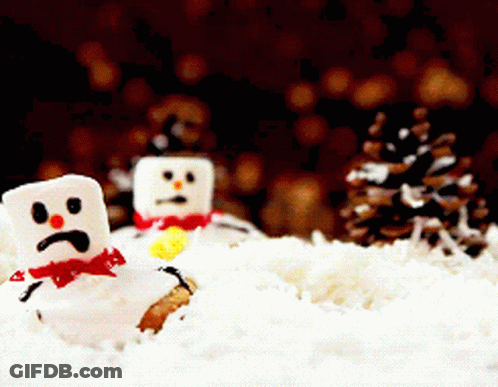 Two Marshmallow Snowmen With Sad Faces Are In The Snow GIF