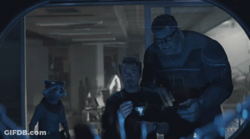 Two Men And A Raccoon Looking Through Window GIF