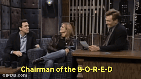 Two Men And A Woman Sitting At Table Saying Chairman Of The B-O-R-E-D GIF