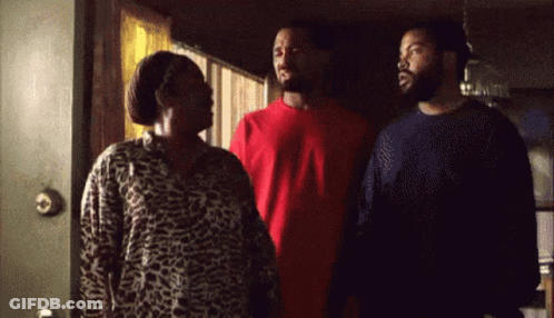 Two Men And A Woman Standing At Door GIF