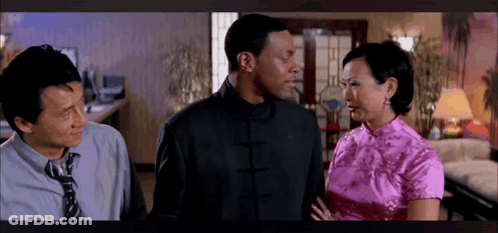Two Men And A Woman Standing In Living Room GIF