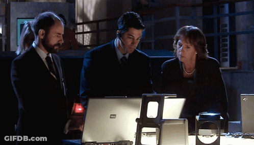 Two Men And Woman Looking At ThinkPad Laptop GIF