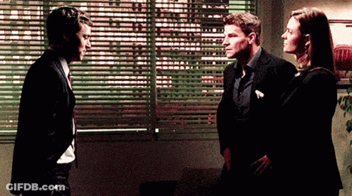 Two Men And Woman Standing In Front Of Window GIF