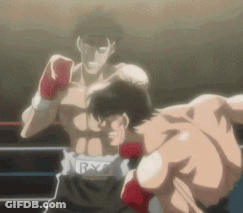 Two Men Are Boxing In A Ring And One Of Them Is Wearing Red Gloves . GIF