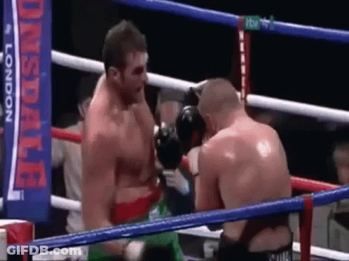 Two Men Are Boxing In A Ring With A Banner In The Background That Says ' Lonsdale London ' . GIF