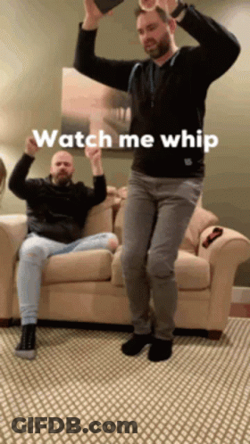 Two Men Are Dancing In A Living Room With The Words Watch Me Whip Written On The Bottom GIF