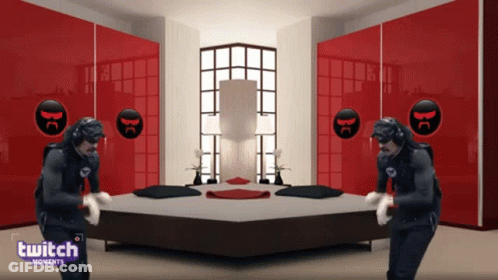Two Men Are Dancing In Front Of A Bed In A Room With A Twitch Logo GIF