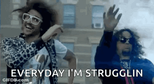 Two Men Are Dancing In Front Of A Building And One Of Them Is Wearing Sunglasses And A Leopard Print Jacket . GIF
