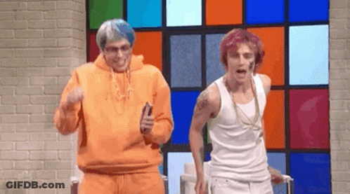 Two Men Are Dancing In Front Of A Colorful Window . GIF