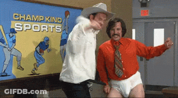 Two Men Are Dancing In Front Of A Painting That Says Champ Kind Sports GIF
