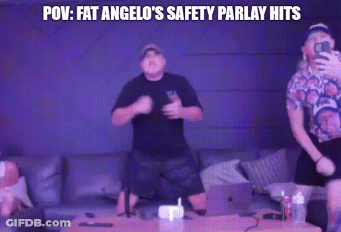 Two Men Are Dancing In Front Of A Purple Wall With The Words POV Fat Angelo 'S Safety Parlay Hits GIF