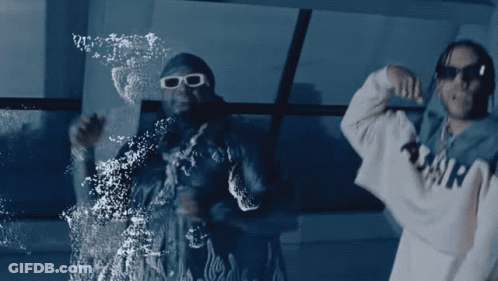 Two Men Are Dancing In Front Of A Window And One Has A Hoodie That Says Amir On It GIF