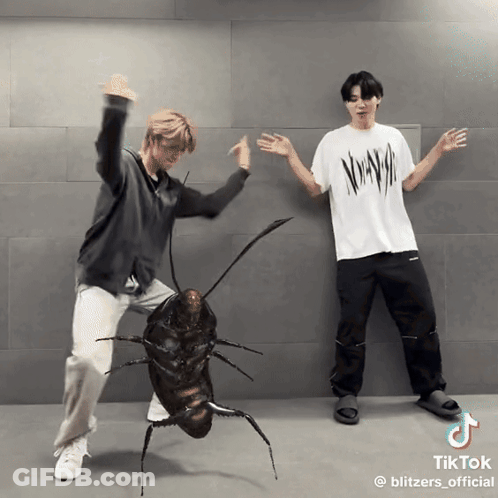Two Men Are Dancing Next To A Cockroach That Has Tiktok Written At The Bottom GIF