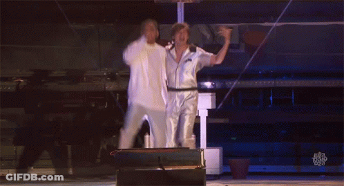 Two Men Are Dancing On A Stage And The Words Ellen Degeneres Are Visible In The Corner GIF
