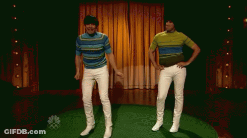 Two Men Are Dancing On A Stage In Front Of A Nbc Sign GIF