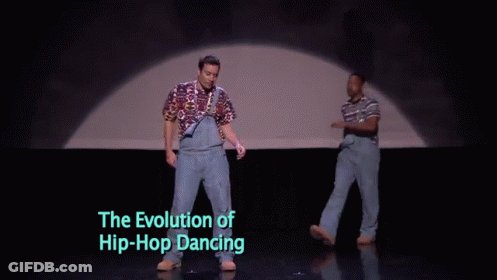 Two Men Are Dancing On A Stage With The Words " The Evolution Of Hip-Hop Dancing " Below Them GIF