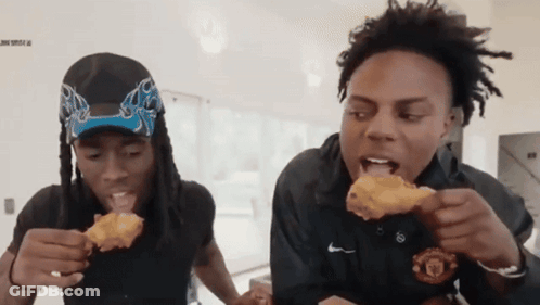 Two Men Are Eating Fried Chicken And One Is Wearing A Nike Shirt GIF