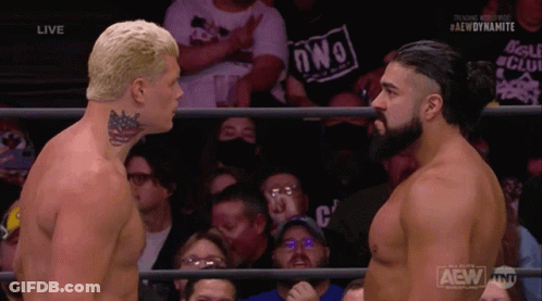 Two Men Are Facing Each Other In A Wrestling Ring With A Crowd Behind Them And The Words Aew Dynamite On The Bottom GIF