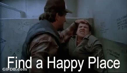Two Men Are Fighting In A Bathroom With The Words `` Find A Happy Place '' Written On The Screen . GIF