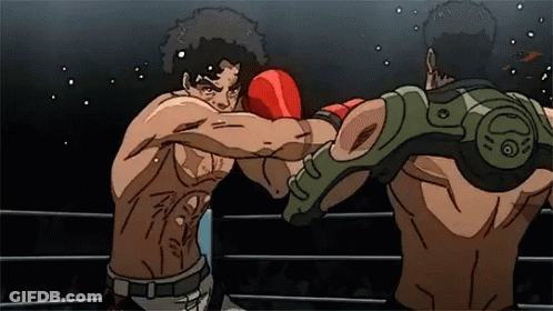 Two Men Are Fighting In A Boxing Ring And One Has A Green Arm Guard GIF