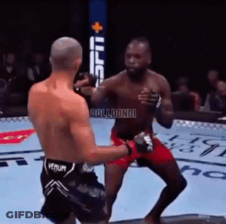 Two Men Are Fighting In A Boxing Ring And One Has The Word Venum On His Shorts GIF