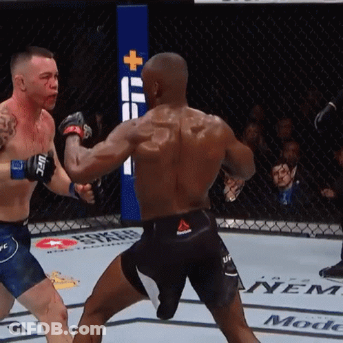 Two Men Are Fighting In A Boxing Ring And One Of Them Has Reebok Shorts On GIF