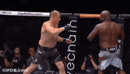 Two Men Are Fighting In A Boxing Ring And One Of Them Is Wearing A Venum Shorts GIF