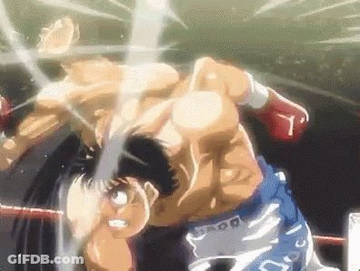 Two Men Are Fighting In A Boxing Ring And One Of Them Is Wearing Shorts That Say ' Ss ' On Them . GIF
