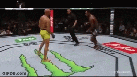 Two Men Are Fighting In A Boxing Ring Sponsored By Monster GIF