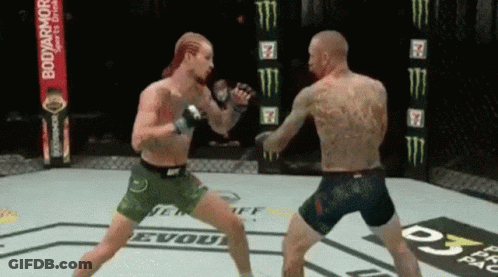Two Men Are Fighting In A Boxing Ring With A Banner For Bodyarmor In The Background GIF