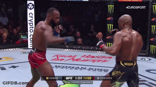 Two Men Are Fighting In A Boxing Ring With A Crypto.com Advertisement In The Background GIF