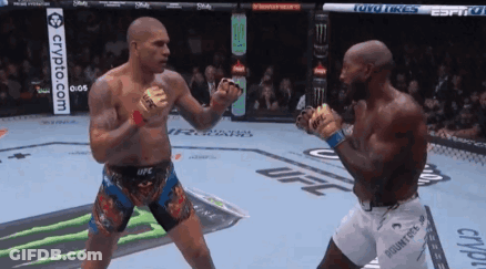 Two Men Are Fighting In A Boxing Ring With A Crypto.com Banner In The Background GIF