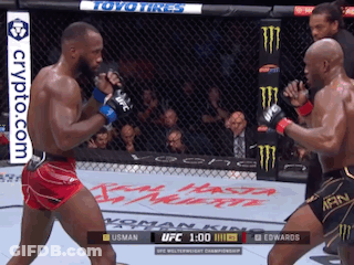 Two Men Are Fighting In A Boxing Ring With A Crypto.com Banner On The Bottom Right GIF