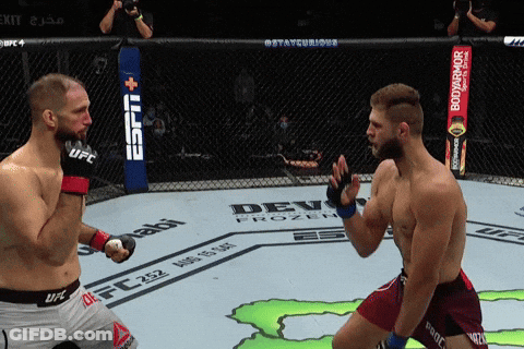 Two Men Are Fighting In A Boxing Ring With A Espn Banner In The Background GIF