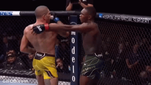 Two Men Are Fighting In A Boxing Ring With A Hospital For Special Surgery Banner Behind Them GIF
