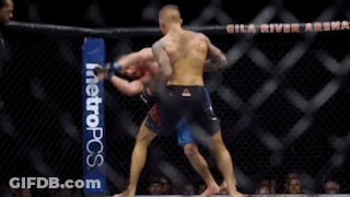 Two Men Are Fighting In A Boxing Ring With A Metropcs Banner On The Side GIF