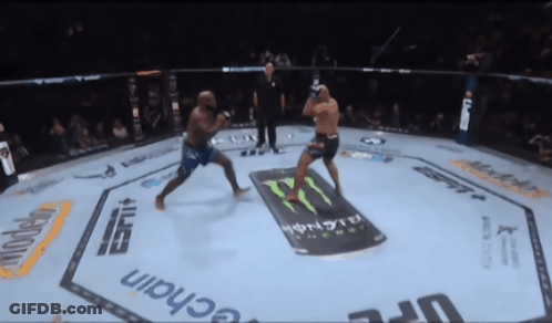 Two Men Are Fighting In A Boxing Ring With A Monster Energy Drink Advertisement On The Floor GIF
