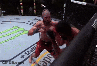Two Men Are Fighting In A Boxing Ring With A Monster Energy Logo In The Background GIF