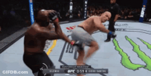Two Men Are Fighting In A Boxing Ring With A Monster Energy Logo On The Floor GIF
