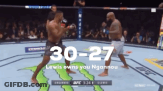 Two Men Are Fighting In A Boxing Ring With A Monster Energy Logo On The Ground GIF