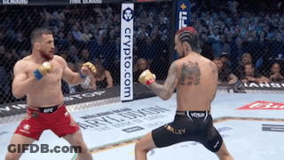 Two Men Are Fighting In A Boxing Ring With A Sign That Says Crypto.com In The Background . GIF