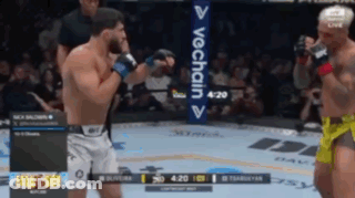 Two Men Are Fighting In A Boxing Ring With A Sign That Says Vechain On It GIF