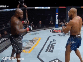 Two Men Are Fighting In A Boxing Ring With Espn On The Side Of The Ring GIF