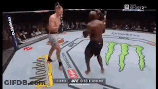 Two Men Are Fighting In A Boxing Ring With Monster On The Floor GIF