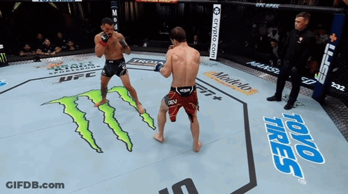 Two Men Are Fighting In A Boxing Ring With Toyo Tires Written On The Floor GIF