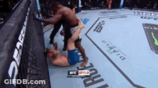 Two Men Are Fighting In A Boxing Ring With Ufc Written On The Corner GIF