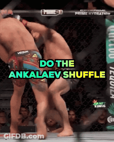 Two Men Are Fighting In A Cage And The Words Do The Ankalaev Shuffle Are On The Screen GIF