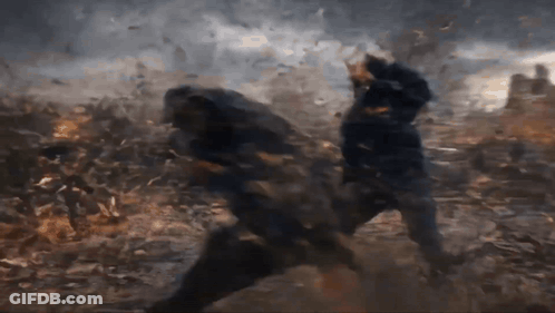 Two Men Are Fighting In A Field With A Lot Of Smoke Coming Out Of The Ground GIF