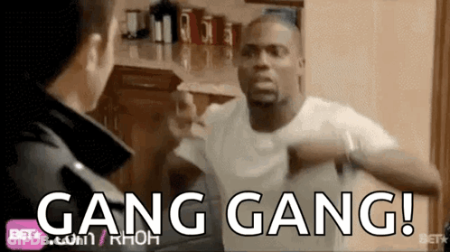 Two Men Are Fighting In A Kitchen With The Words Gang Gang Written On The Screen GIF