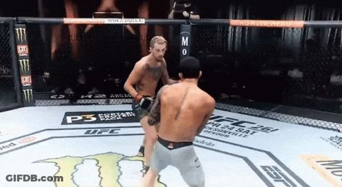 Two Men Are Fighting In A Ufc Ring With A Monster Energy Logo On The Floor GIF